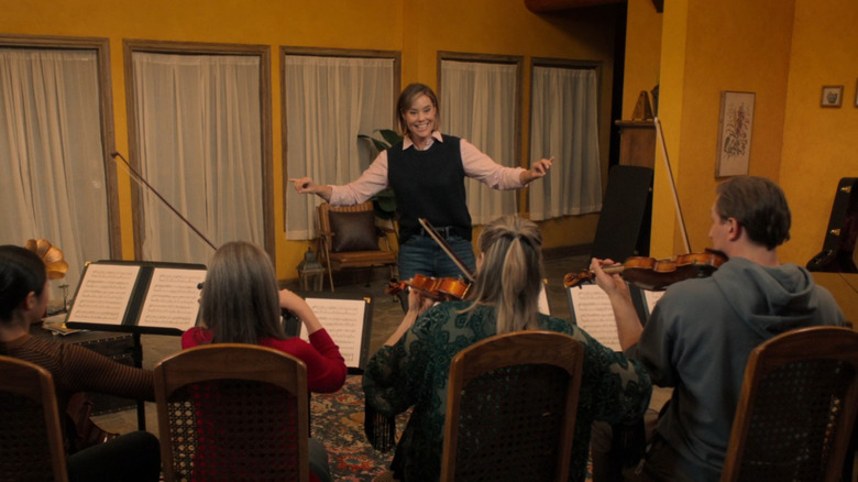 Ashley Williams conducting music in scene of "Notes of Autumn"