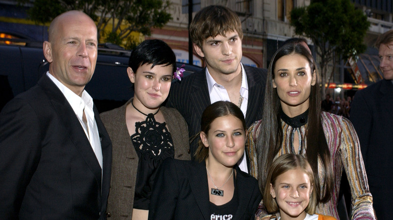 Ashton Kutcher with Demi Moore, Bruce Willis, and their kids.