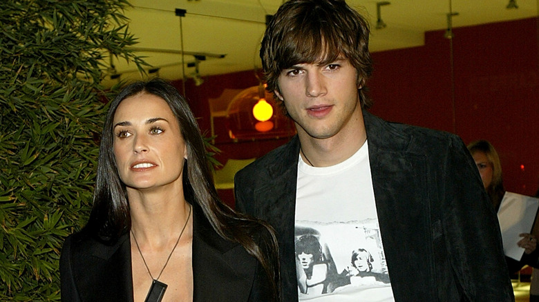 Ashton Kutcher and Demi Moore attend the 2003 opening of the Stella McCartney Store