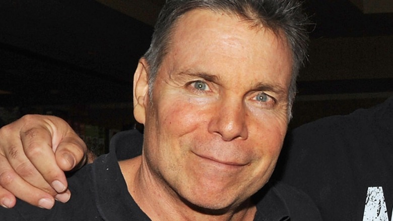 Lanny Poffo smiling wearing black shirt