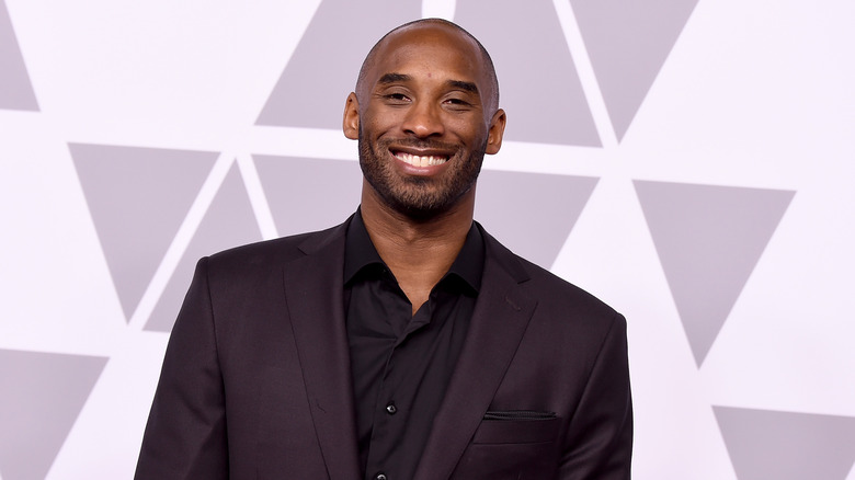 Kobe Bryant smiles on the red carpet