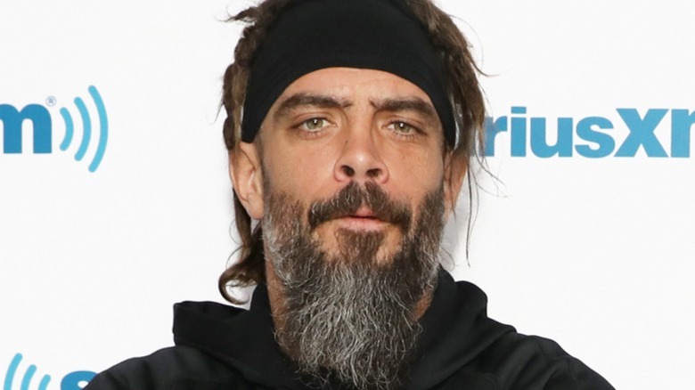 Jay Briscoe poses in black hoodie