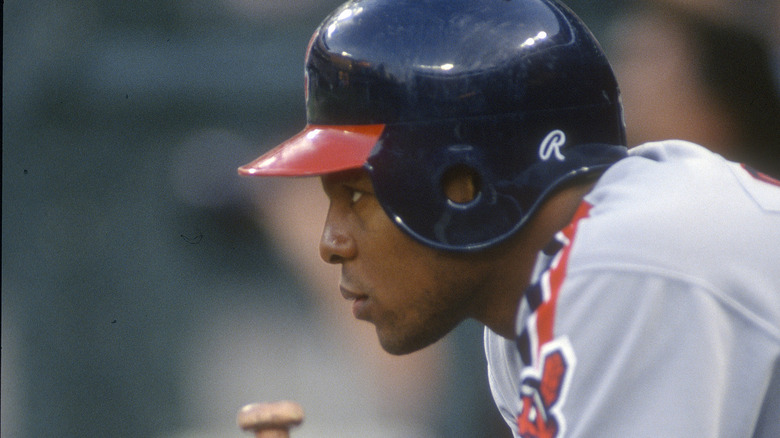 Albert Belle seated during baseball game