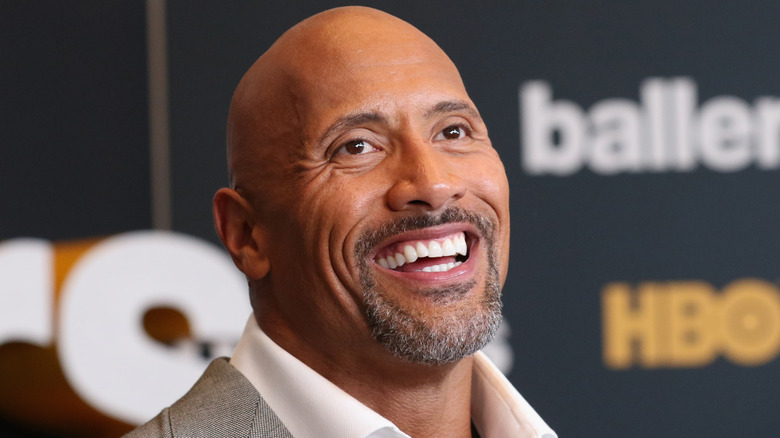 Dwayne Johnson smiling  at event