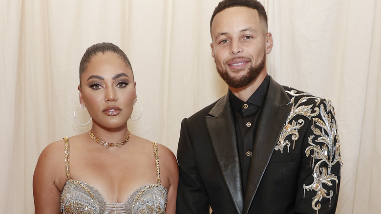 Steph Curry and Ayesha Curry, both smiling