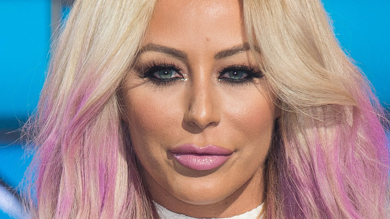 Aubrey O'Day posing in pink hair