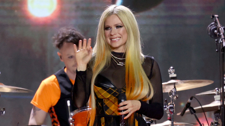 Avril Lavigne smiling on stage