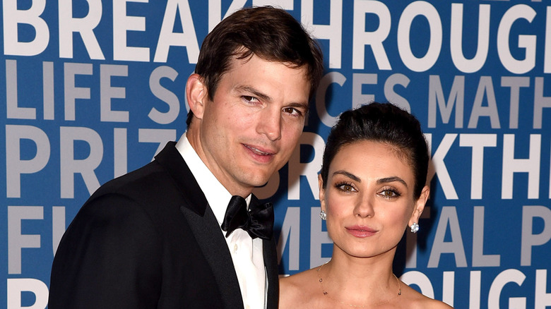 Ashton Kutcher and Mila Kunis in formal wear