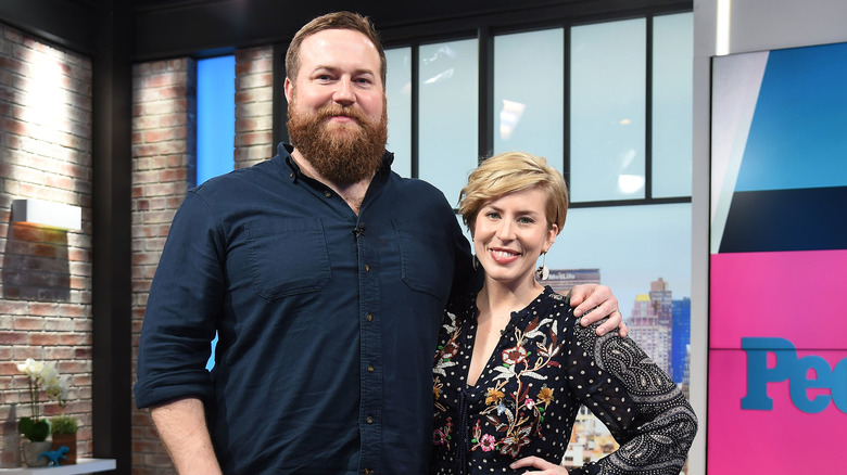 Ben and Erin Napier smiling with arms around each other