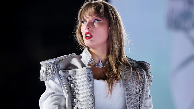 Taylor Swift looking to side in TTPD Eras costume