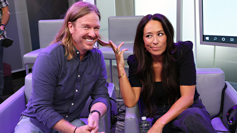 Chip and Joanna Gaines pose playfully during an interview