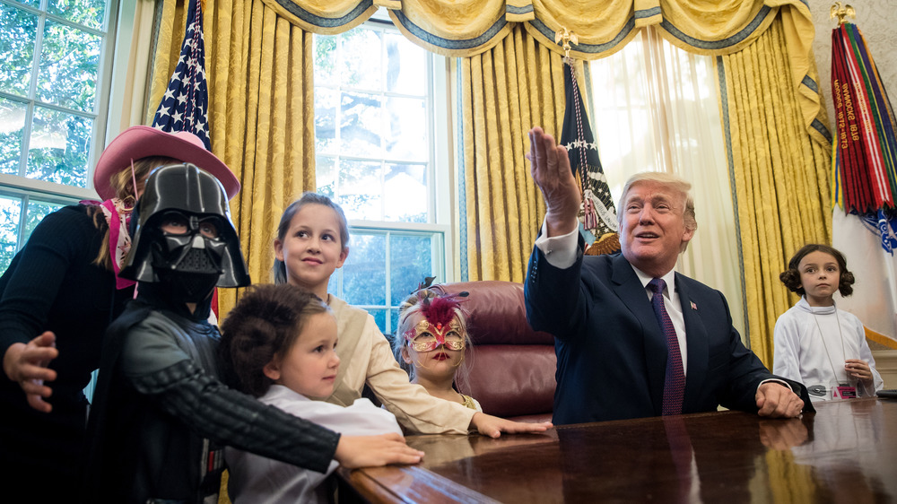 Donald Trump giving out Halloween candy in 2017