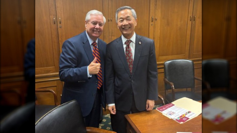 Lindsey Graham posing with the President Andrew Hsu of the College of Charleston.
