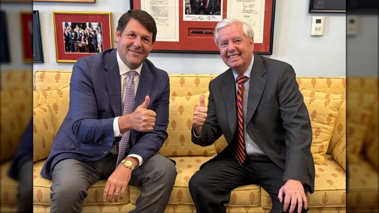 Jodey Arrington and Lindsey Graham pose together giving "Thumbs up" to the camera.