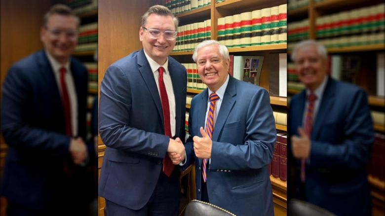 Lindsey Graham poses shaking hands with Mike Hough.