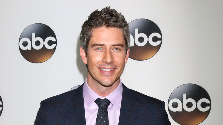Arie Luyendyk Jr. posing in front of ABC logos