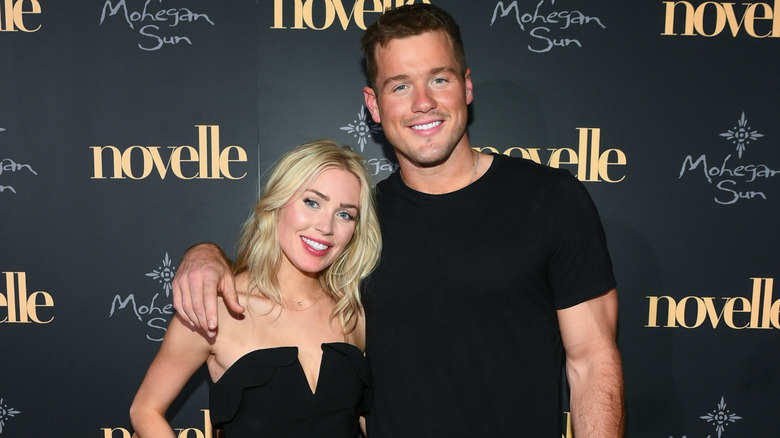 Cassie Randolph posing with Colton Underwood on red carpet