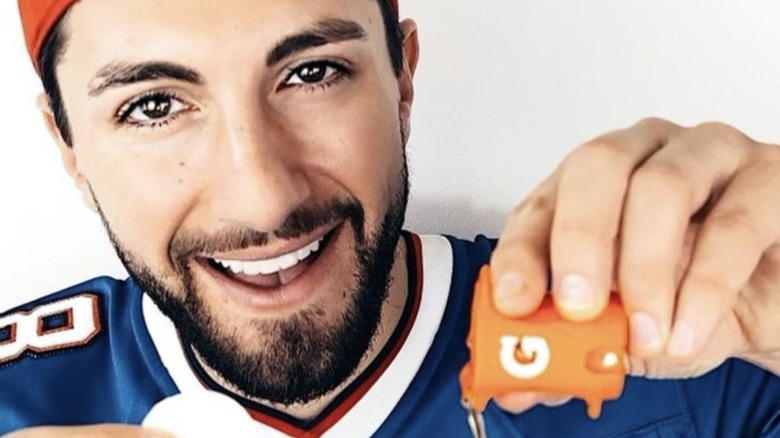 Jason Tartick pours gatorade