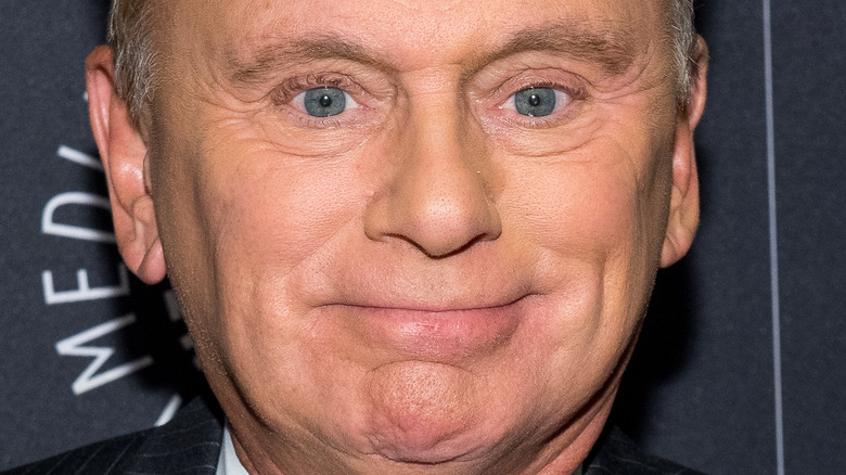 Pat Sajak smiling tightly