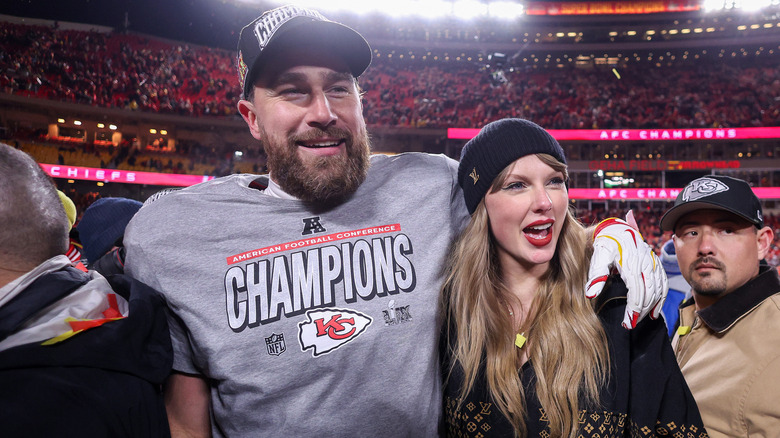 Travis Kelce and Taylor Swift on the field