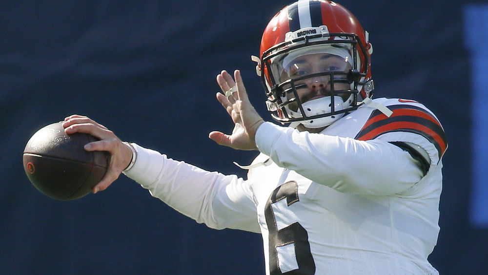 Baker Mayfield throwing a football