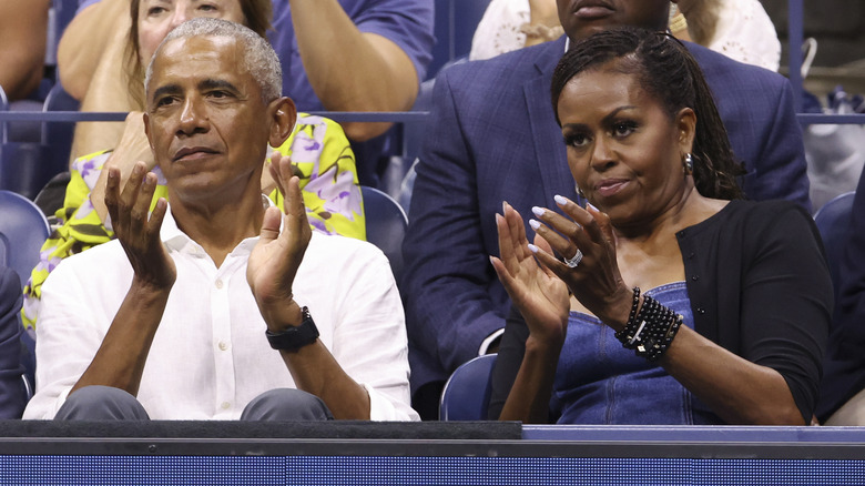 Barack Obama and Michelle Obama attending the men's singles first round match during day one of the 2023 US Open