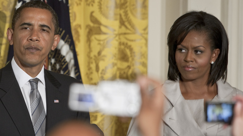 Barack Michelle Obama looking unhappy