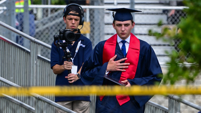 Barron Trump wearing graduation cap and gown