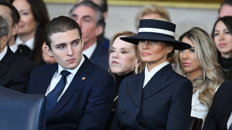 Barron Trump sits next to Melania Trump