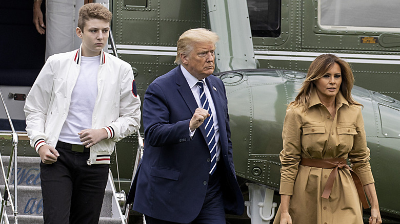 Barron Trump and his parents walking away from Marine One