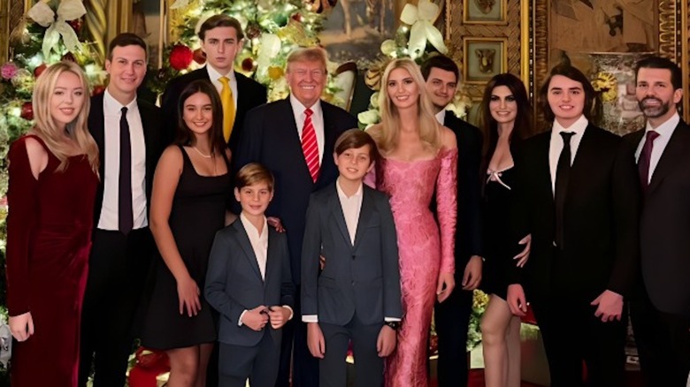 Trump family posing with Christmas trees
