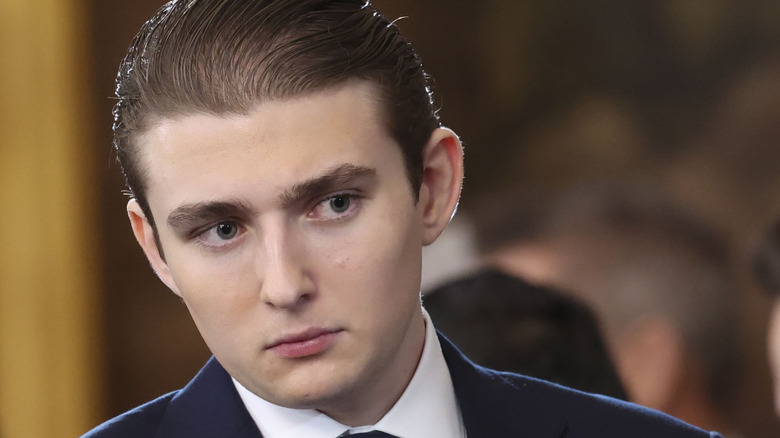 Barron Trump looking to the side