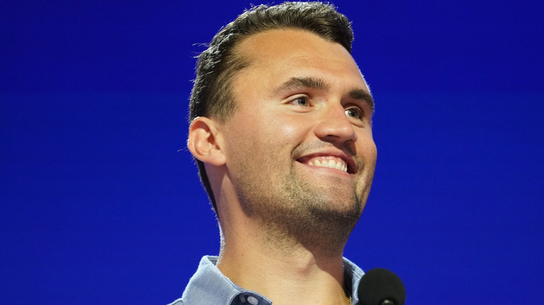 Charlie Kirk smiling on stage