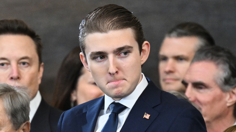 Barron Trump wearing a flag pin at the inauguration