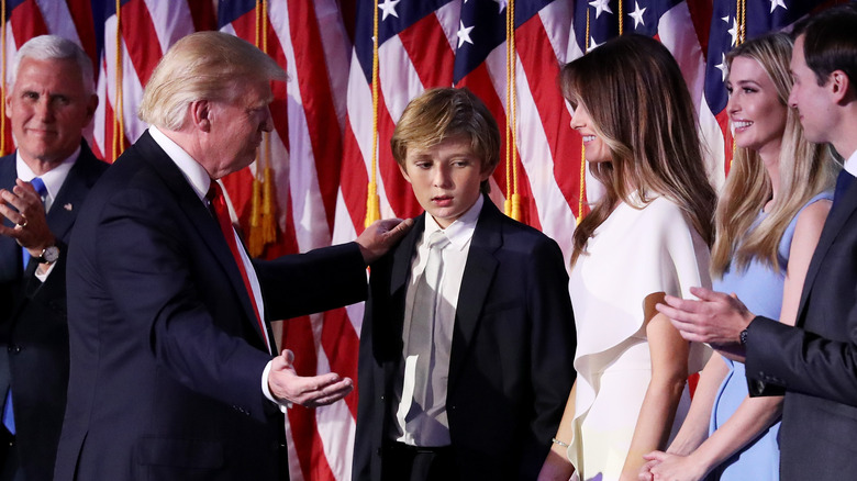 Donald Trump with hand on Barron Trump's shoulder