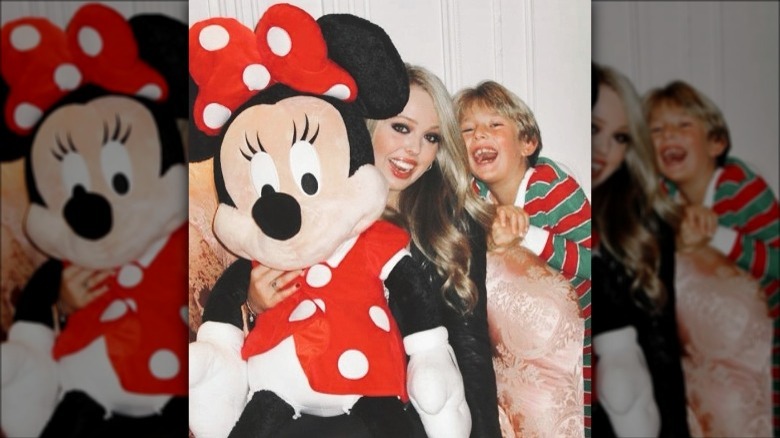 Young Tiffany and Barron Trump pose with Minnie