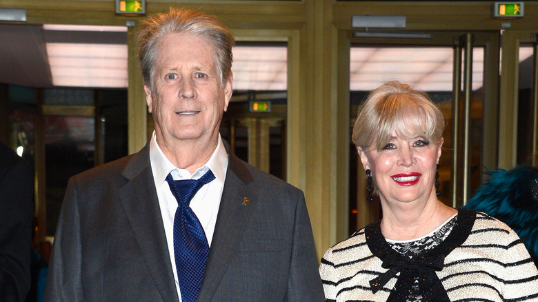 Brian and Melinda Wilson stand near doors