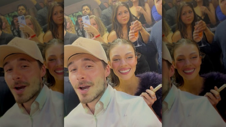 Brooklyn Beckham and Nicola Peltz pose at New Year's Eve party