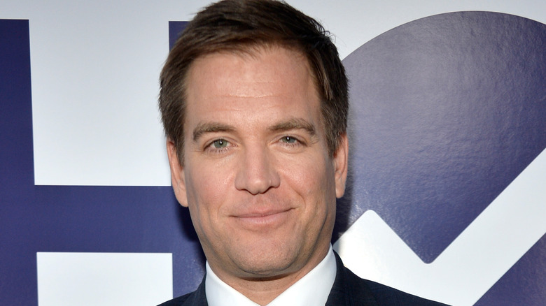 Michael Weatherly wears black suit