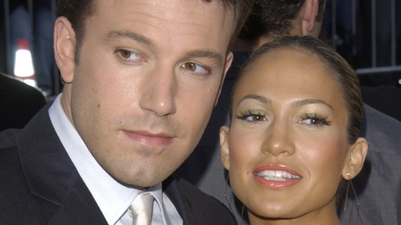 Ben Affleck and Jennifer Lopez smiling and talking