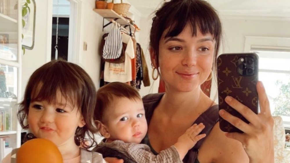 Bekah Martinez posing for a selfie with her daughter and son