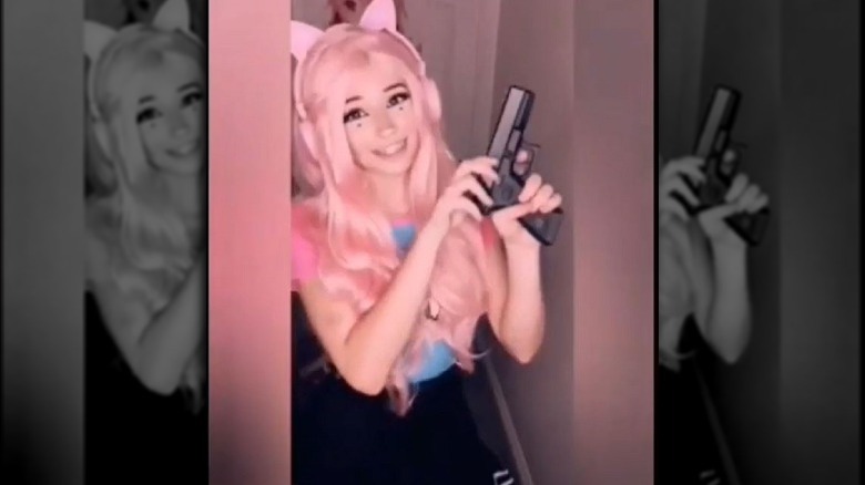 Belle Delphine smiling pistol