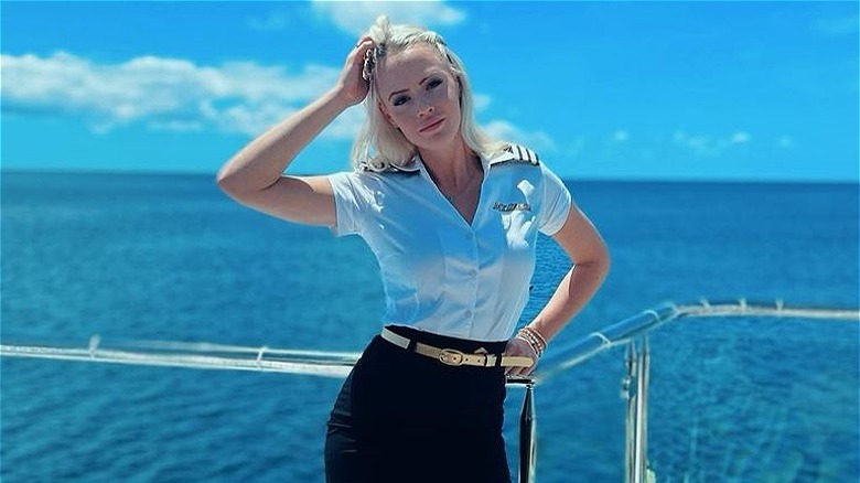 Heather Chase posing on a yacht
