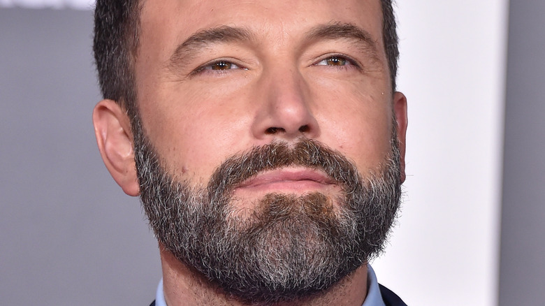 Ben Affleck poses in a navy suit