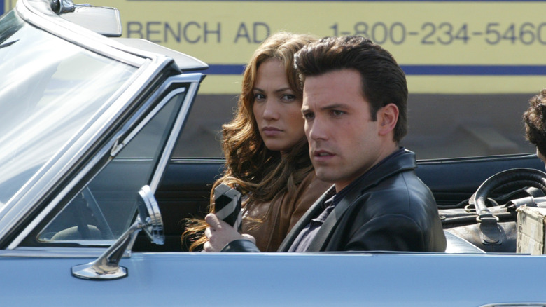 Jennifer Lopez and Ben Affleck filming Gigli, seated in car