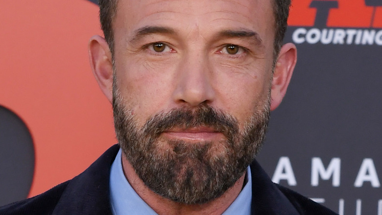 Ben Affleck, smirking