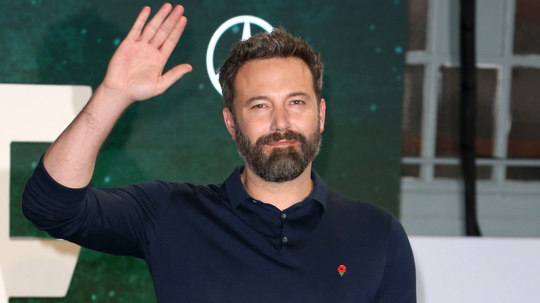 Ben Affleck waving on a red carpet