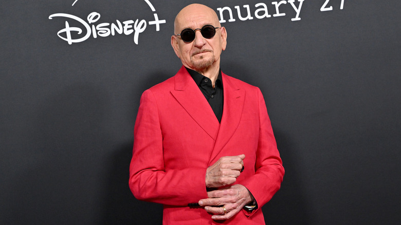 Ben Kingsley posing on the red carpet.