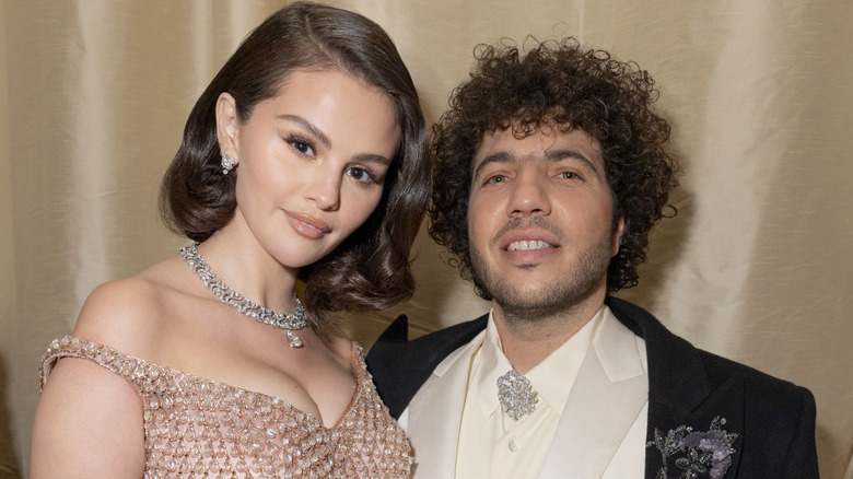 Selena Gomez and Benny Blanco pose at the 2025 Oscars