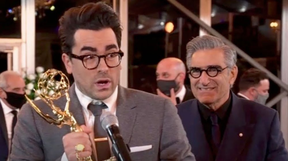 Daniel Levy and Eugene Levy accepting awards at the 2020 Emmys